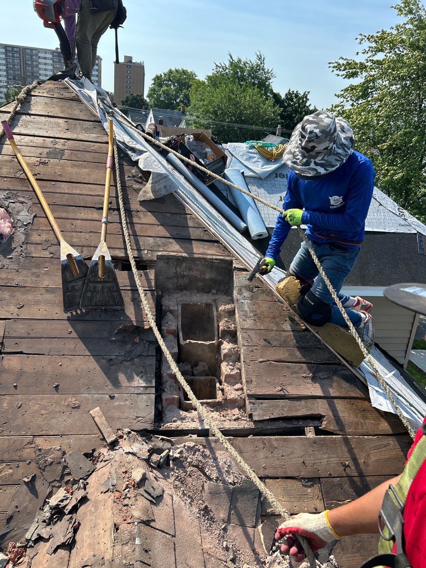 Close-up of new GAF shingles meeting the ridge vent on a freshly completed North Jersey roof