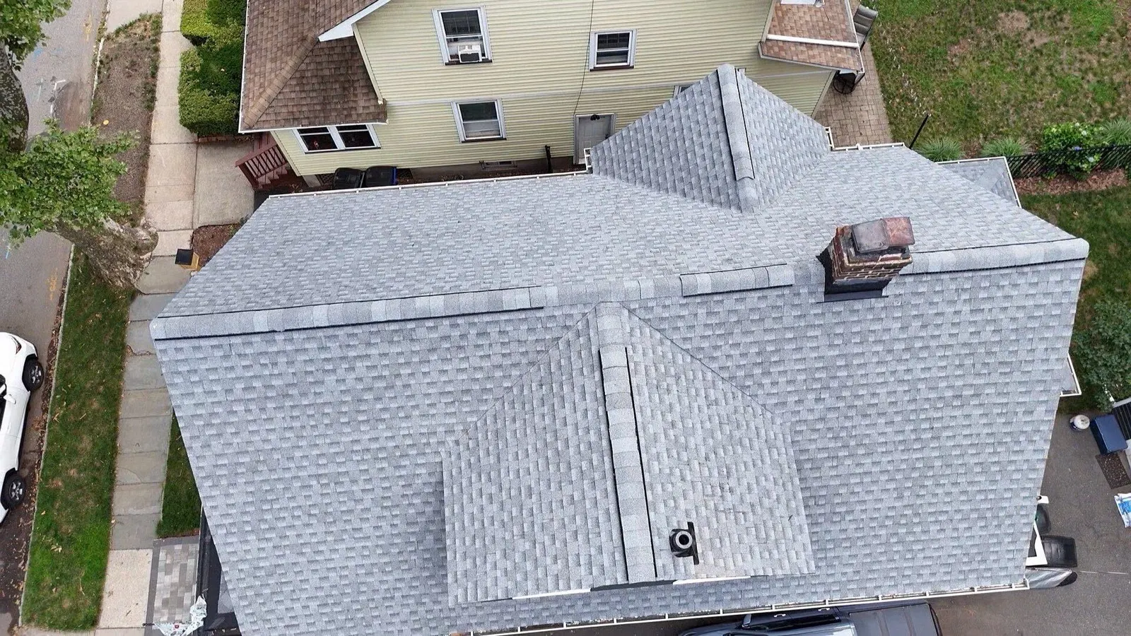 Completed hipped roof with GAF shingles — GAF Master Elite® certified