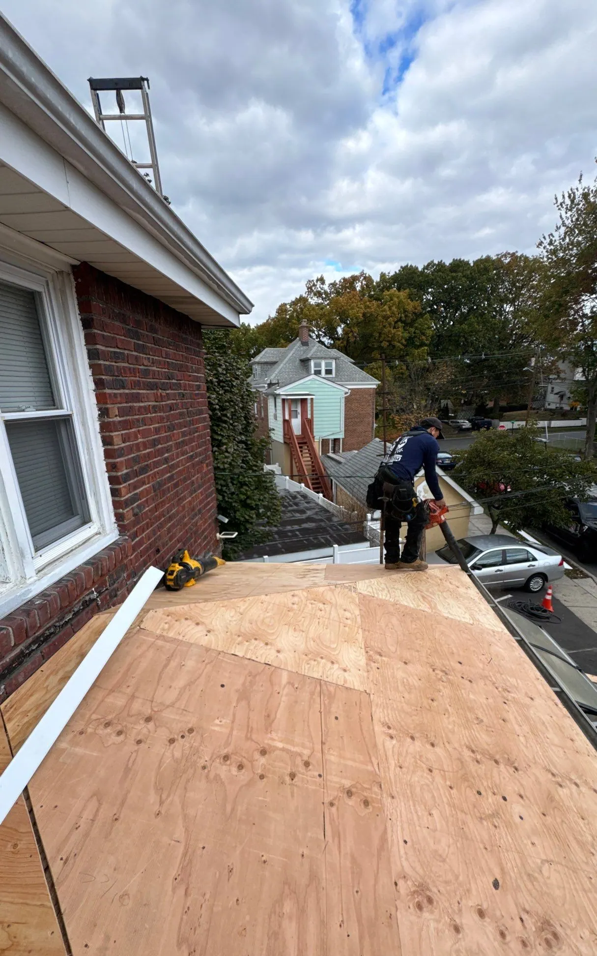 Fresh plywood decking installed where an LGM crew replaced rotted roof sheathing