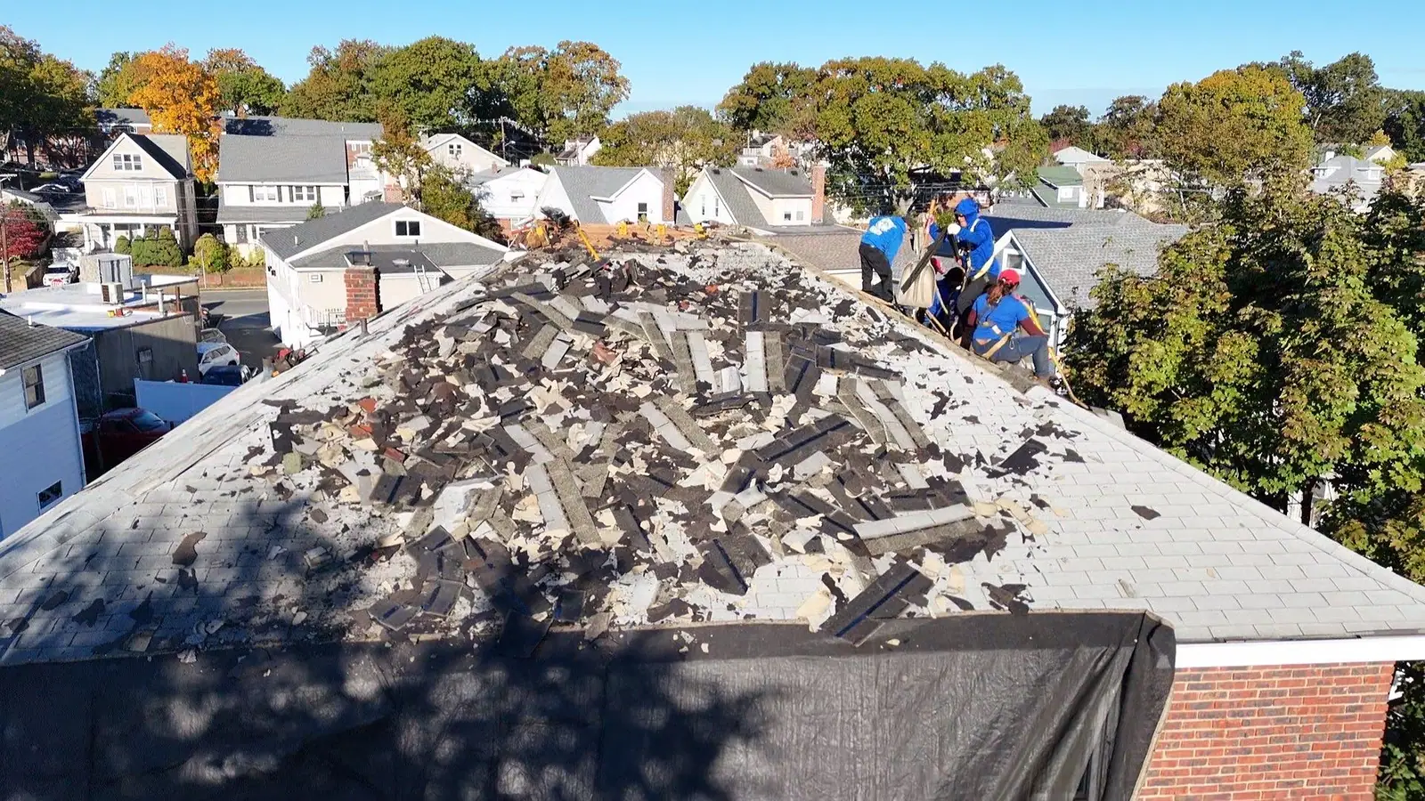 Aerial view of LGM crew stripping old shingles from a North Jersey roof