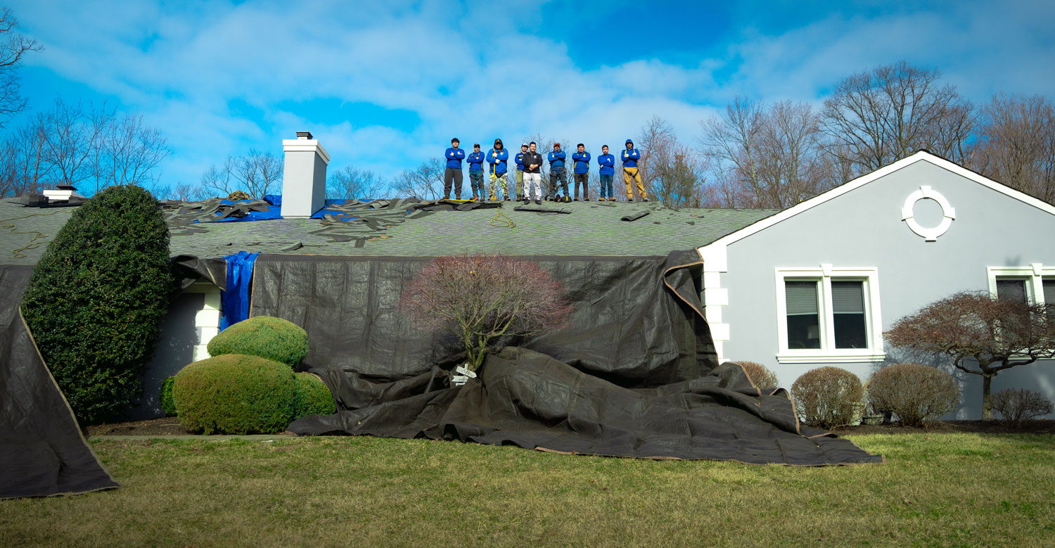 The LGM Roofing crew standing atop a completed North Jersey roof replacement