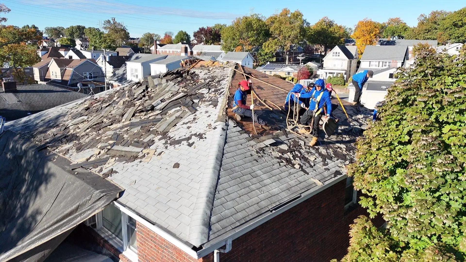 roof replacement professional crew preparing residential home - what to expect during a roof replacement