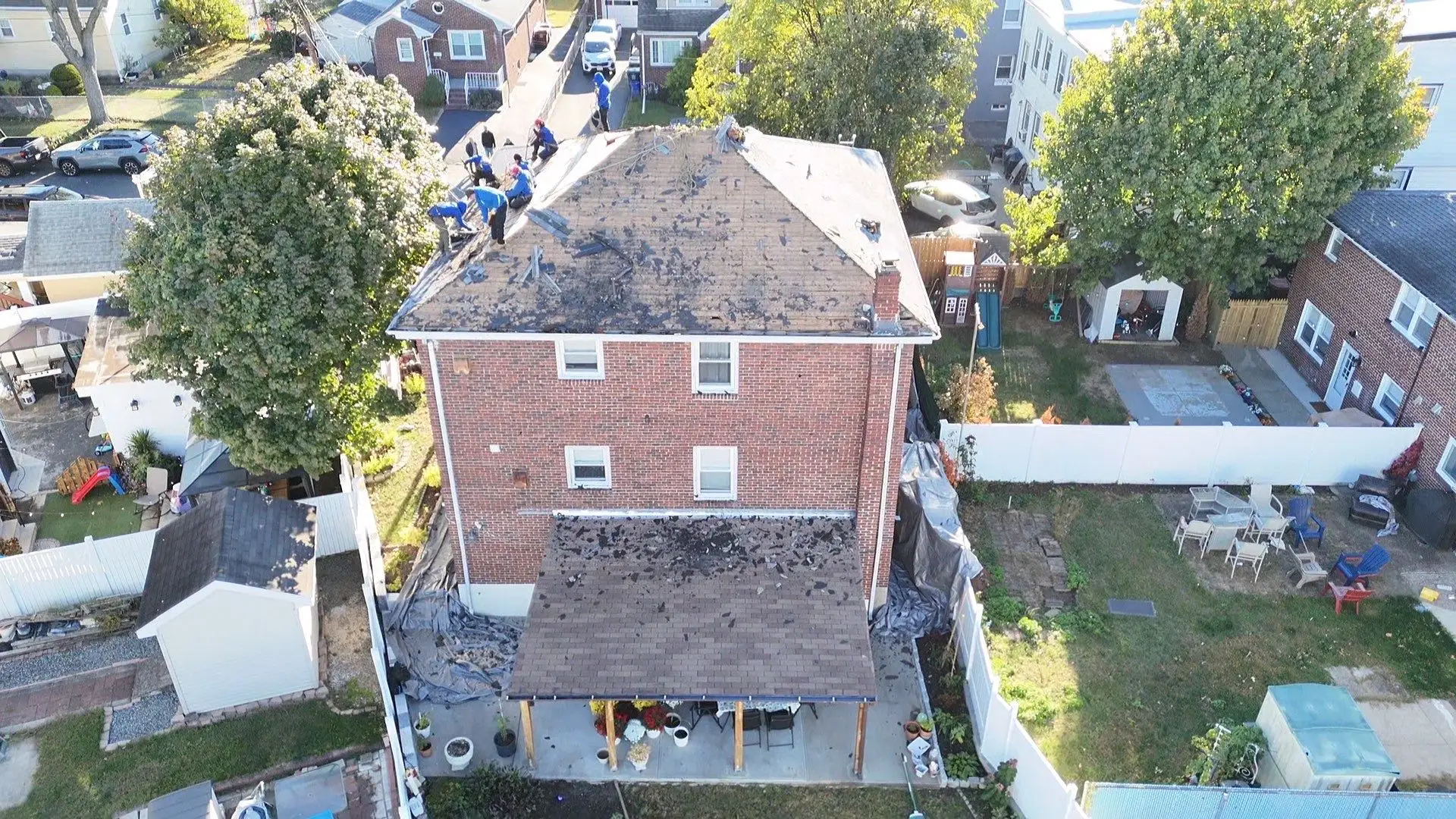 roof on a classic Northeast home during seasonal transition