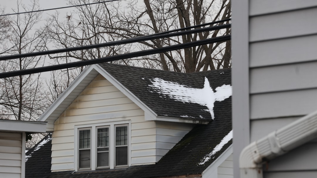 freeze thaw cycles damage roofing and siding on a New Jersey home covered in snow and ice