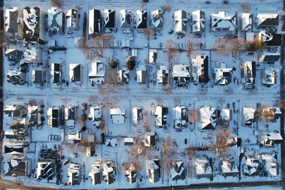 snow-covered residential roof in New Jersey winter