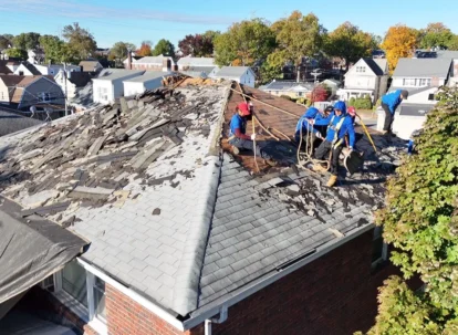 Residential roof installation crew working on modern home showing active replacement timeline